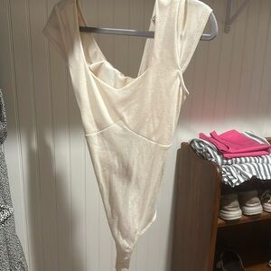 Cream colored body suit